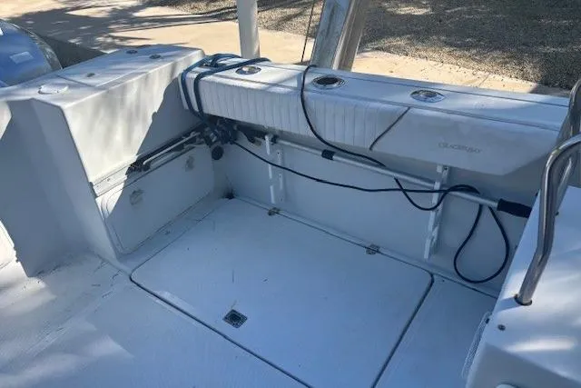 Slide: The Image of 2008 Glacier Bay 2670 Cuddy boat interior with seating and storage compartments. - 24