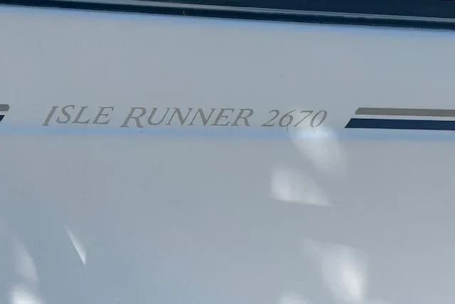 Slide: The Image of 2008 Glacier Bay 2670 Cuddy boat with "Isle Runner 2670" text on hull. - 4