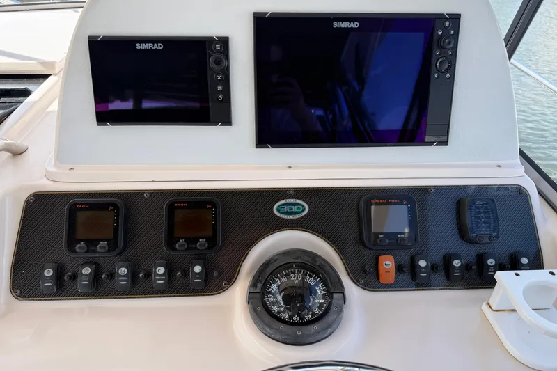 Slide: The Image of Dashboard of 2009 Grady-White Marlin 300 with Simrad displays and navigation instruments. - 14