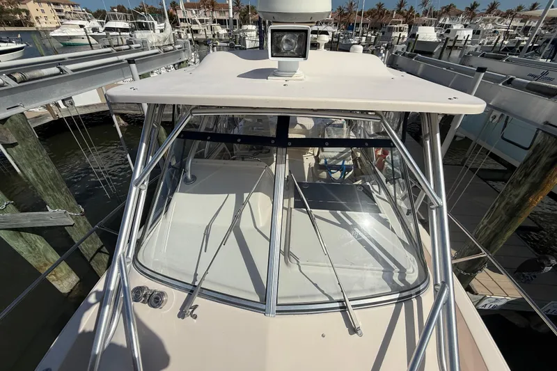 Slide: The Image of 2009 Grady-White Marlin 300 boat docked at marina, top view. - 16