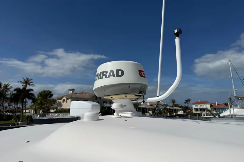 Slide: The Image of Radar equipment on 2009 Grady-White Marlin 300 boat under clear blue sky. - 17