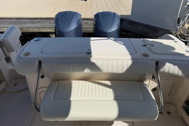 Slide: The Image of 2009 Grady-White Marlin 300 boat with dual engines and cushioned seating at the dock. - 29