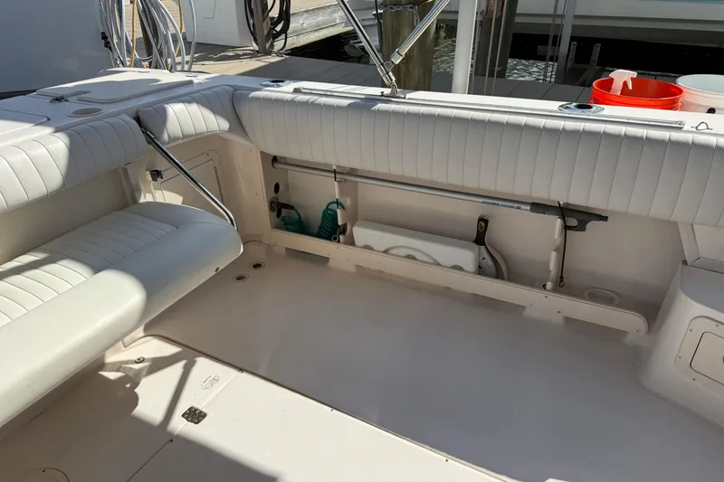Slide: The Image of 2009 Grady-White Marlin 300 boat interior with white seating and storage compartments. - 30