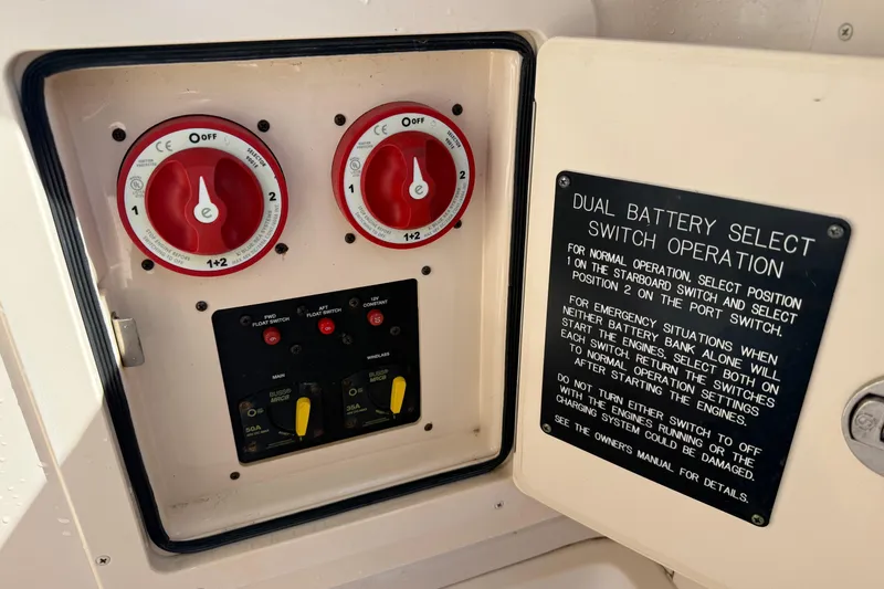Slide: The Image of 2009 Grady-White Marlin 300 dual battery switch panel with operation instructions. - 37