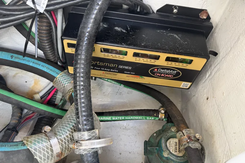 Slide: The Image of Battery charger and wiring inside a 2009 Grady-White Marlin 300 boat. - 38