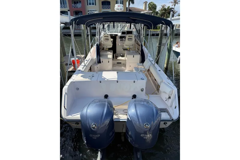 Slide: The Image of 2009 Grady-White Marlin 300 boat with dual Yamaha outboard engines docked at marina. - 8