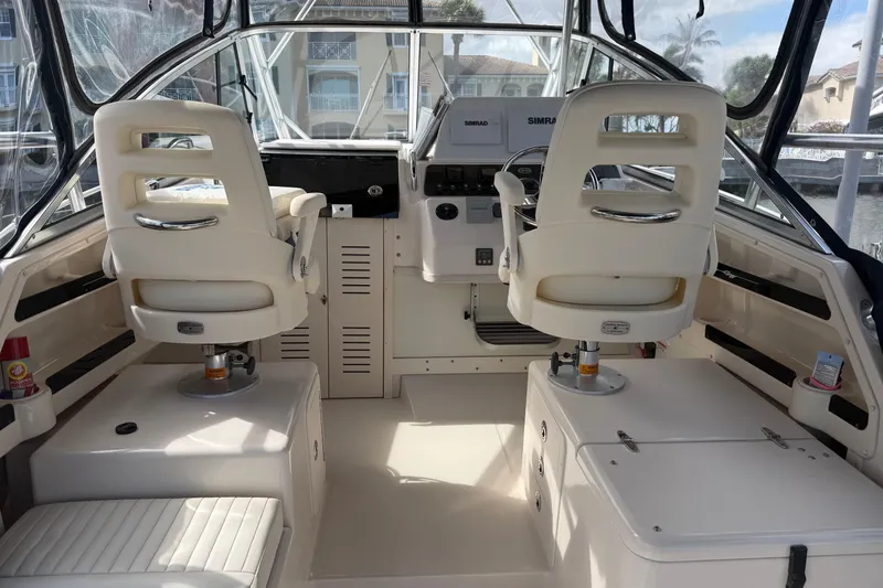 Slide: The Image of 2009 Grady-White Marlin 300 boat interior with helm and seating area. - 9