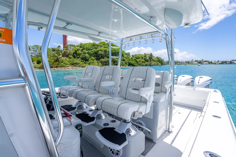 Slide: The Image of Contender 44 CB 2021 boat interior with plush seating and ocean view. - 13