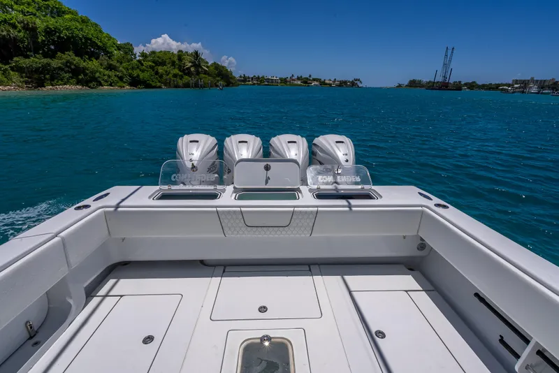 Slide: The Image of Contender 44 CB 2021 boat with four engines on a clear blue sea. - 18