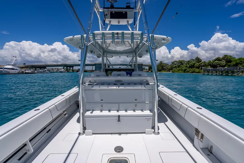 Slide: The Image of 2021 Contender 44 CB boat on clear blue water under a sunny sky. - 19
