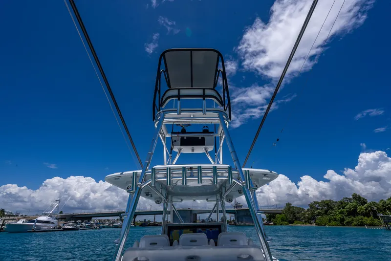Slide: The Image of 2021 Contender 44 CB boat on blue water under a clear sky. - 33