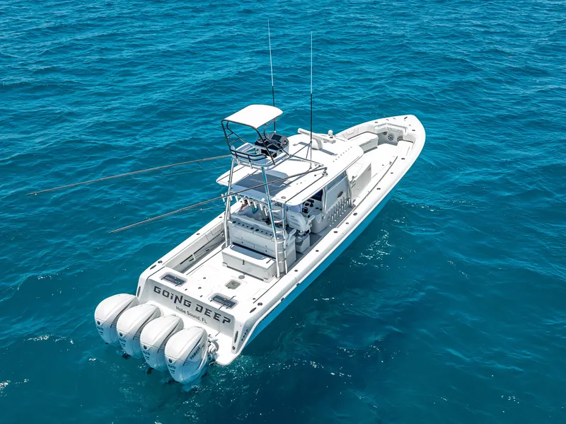 Slide: The Image of 2021 Contender 44 CB boat with four engines on open ocean. - 36