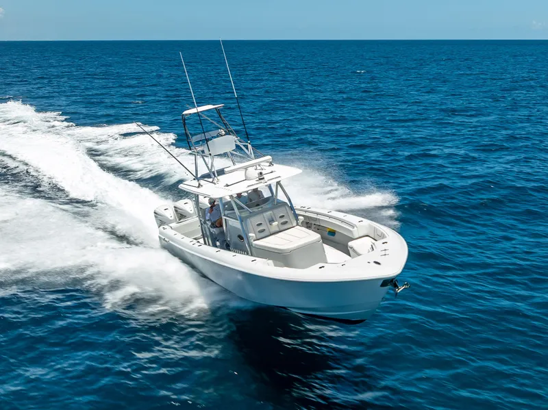 Slide: The Image of 2021 Contender 44 CB boat cruising on open blue ocean waters. - 4