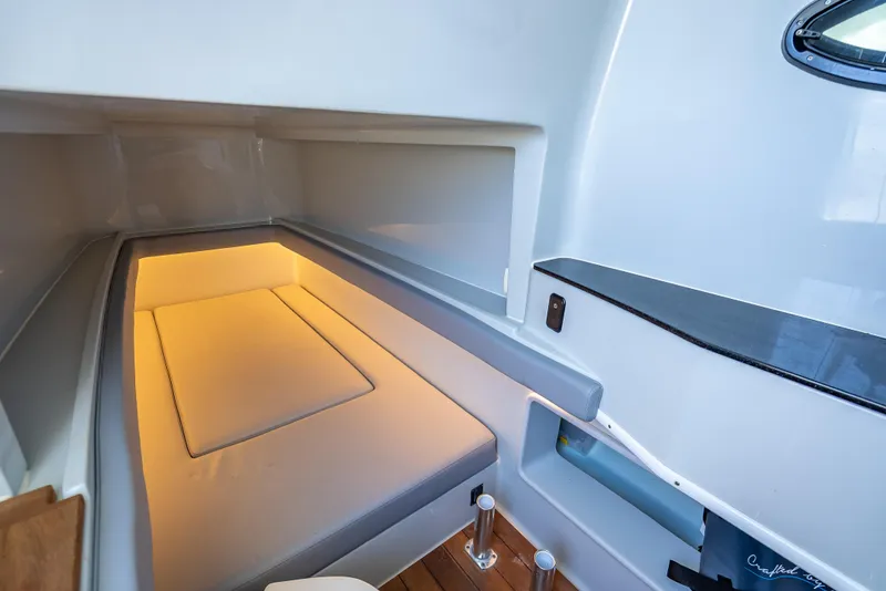 Slide: The Image of Interior cabin of 2021 Contender 44 CB boat with cozy lighting and modern design. - 40