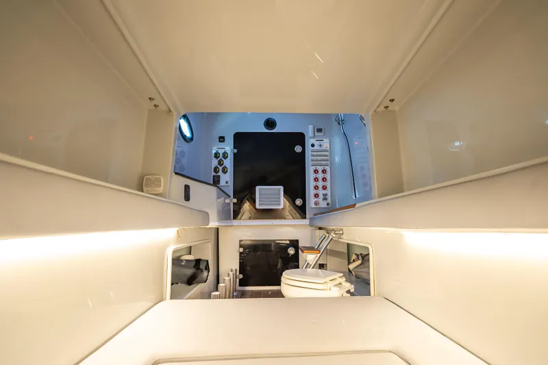 Slide: The Image of Interior view of 2021 Contender 44 CB boat cabin with control panel and lighting. - 42