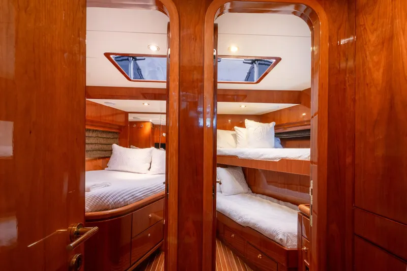 Slide: The Image of Luxurious 2003 Hargrave Skylounge yacht interior with elegant wood finish and cozy bedding. - 25