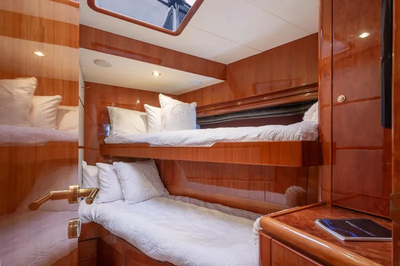 Slide: The Image of Luxurious cabin interior of 2003 Hargrave Skylounge yacht with wooden finish and cozy bedding. - 27