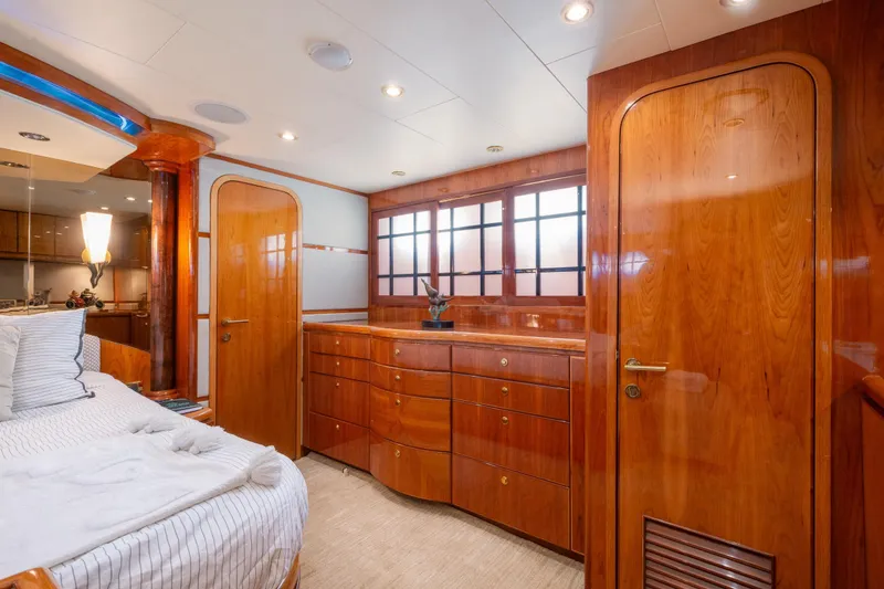 Slide: The Image of Luxurious 2003 Hargrave Skylounge yacht interior with elegant wood finishes and cozy bedroom. - 32