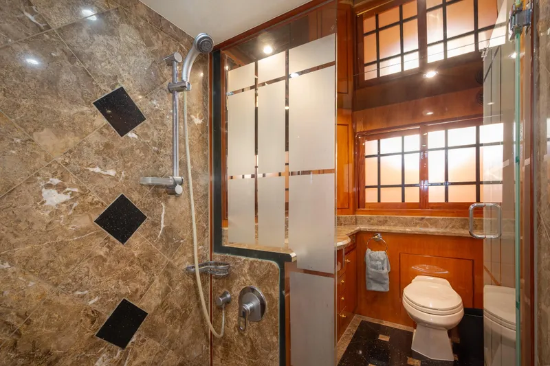 Slide: The Image of Luxurious bathroom in 2003 Hargrave Skylounge yacht with marble shower and elegant wood accents. - 34