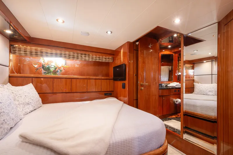 Slide: The Image of Luxurious 2003 Hargrave Skylounge yacht bedroom with wood paneling and elegant decor. - 36