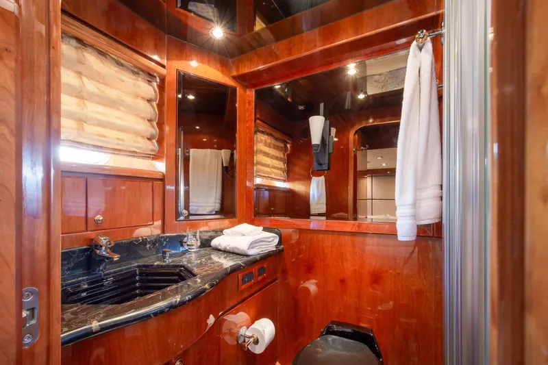 Slide: The Image of Luxurious bathroom in 2003 Hargrave Skylounge yacht with wood accents and marble sink. - 38