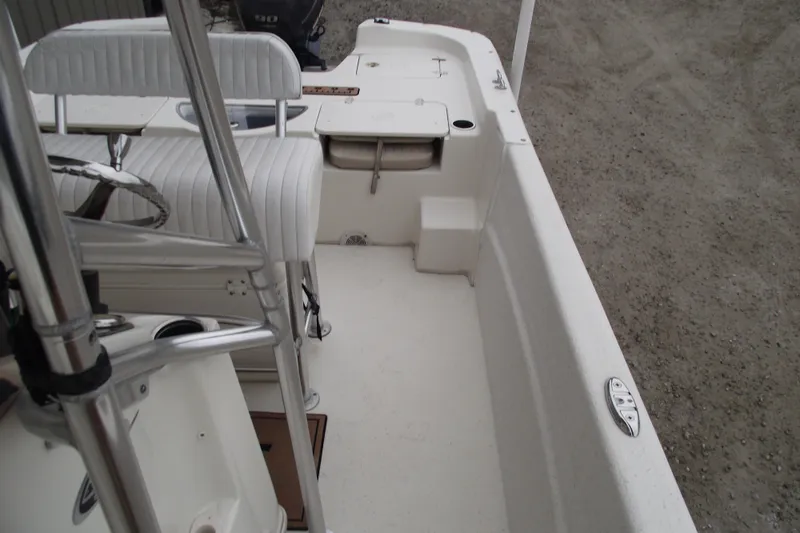 Slide: The Image of 2016 Carolina Skiff 198 DLV boat interior with seating and steering wheel. - 13