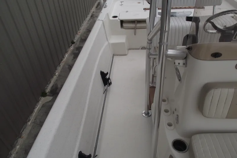 Slide: The Image of 2016 Carolina Skiff 198 DLV boat interior with seating and steering console. - 14