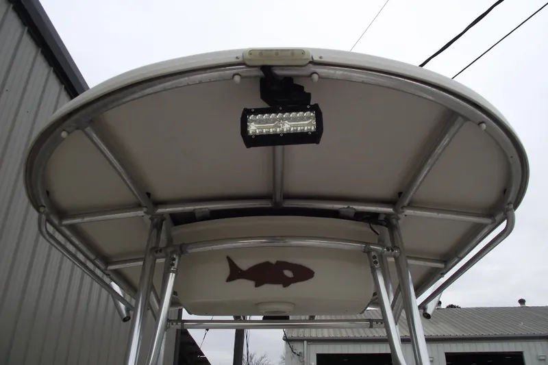 Slide: The Image of 2016 Carolina Skiff 198 DLV boat canopy with mounted light and fish design. - 15