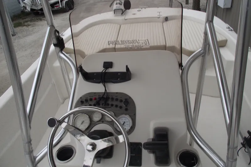 Slide: The Image of 2016 Carolina Skiff 198 DLV boat console with steering wheel and gauges. - 17