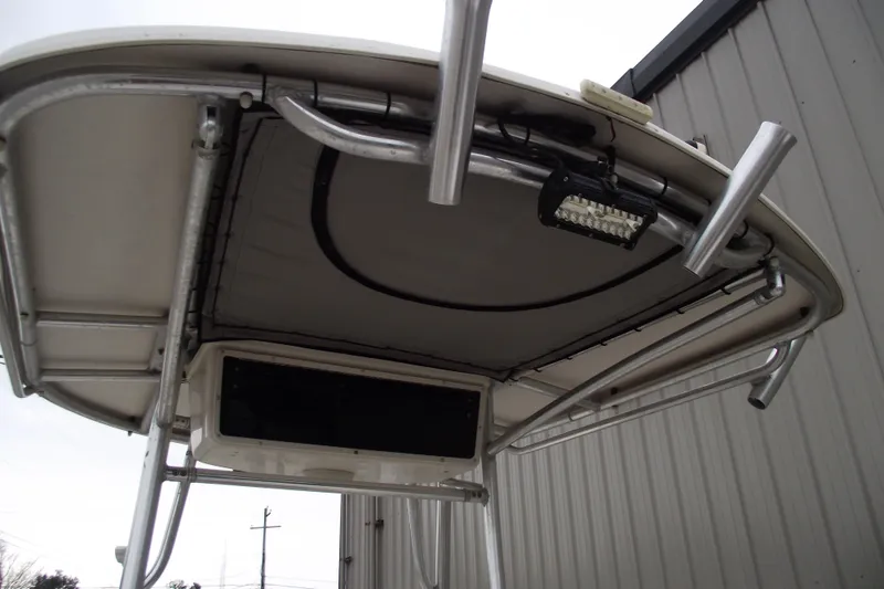 Slide: The Image of 2016 Carolina Skiff 198 DLV boat canopy with mounted light and metal frame. - 27