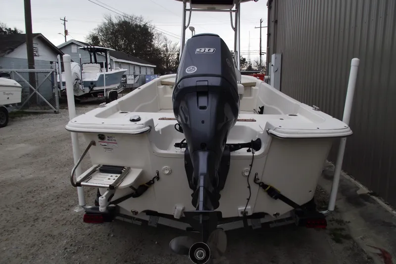 Slide: The Image of 2016 Carolina Skiff 198 DLV boat with 90 HP outboard motor, rear view. - 3