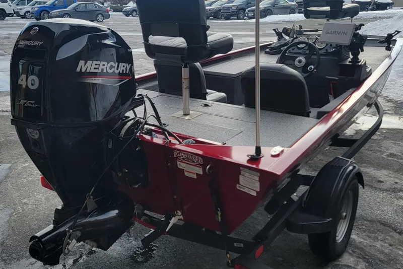 Slide: The Image of 2024 Tracker Pro 170 boat with Mercury 40 engine, parked on a trailer. - 3