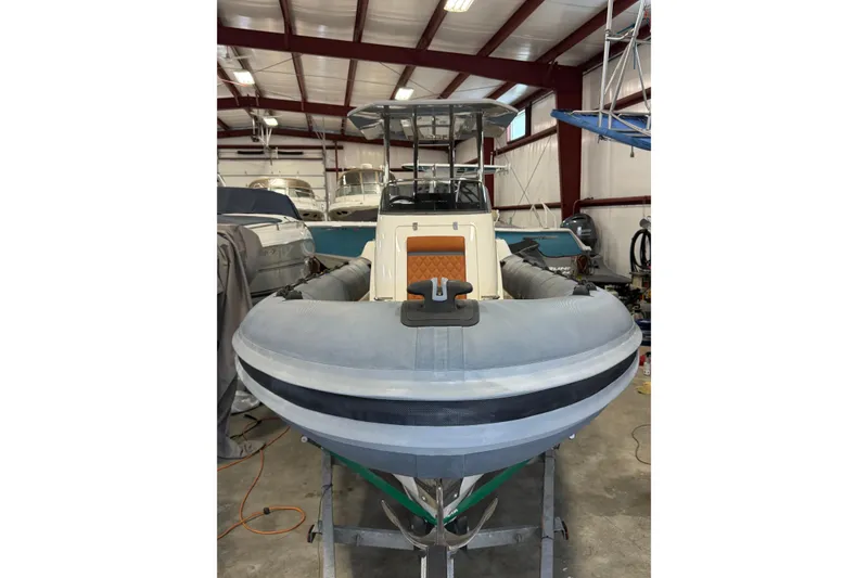 The Image of 2023 Cobra Ribs Nautique 8.2m boat in storage, front view in a warehouse. - 0