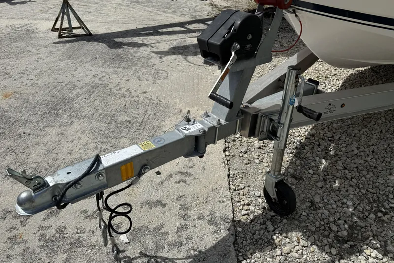 Slide: The Image of Trailer hitch of 2017 Robalo R160 Center Console boat on concrete surface. - 14