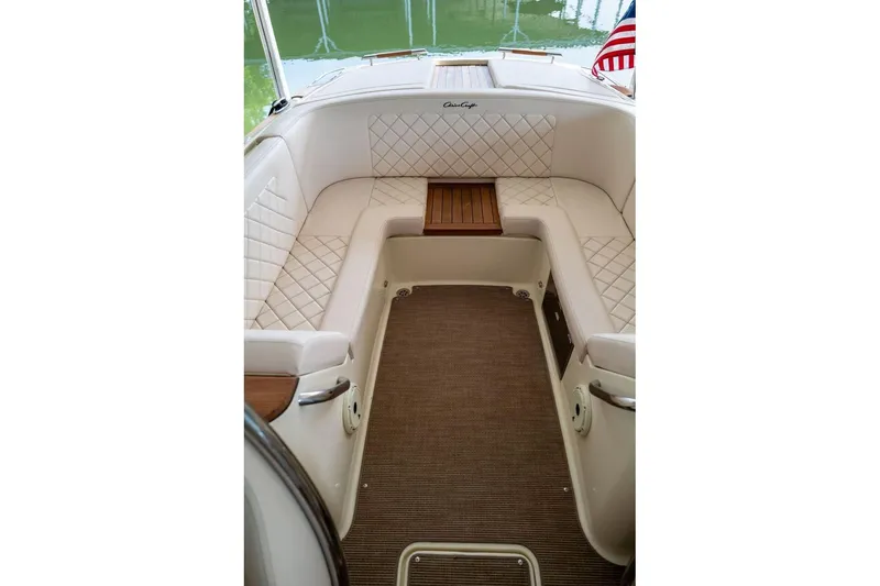 Slide: The Image of Luxurious interior of 2023 Chris-Craft Launch 27 boat with elegant seating and wood accents. - 8
