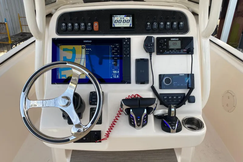 Slide: The Image of 2024 Grady-White Fisherman 257 dashboard with advanced navigation and control systems. - 4