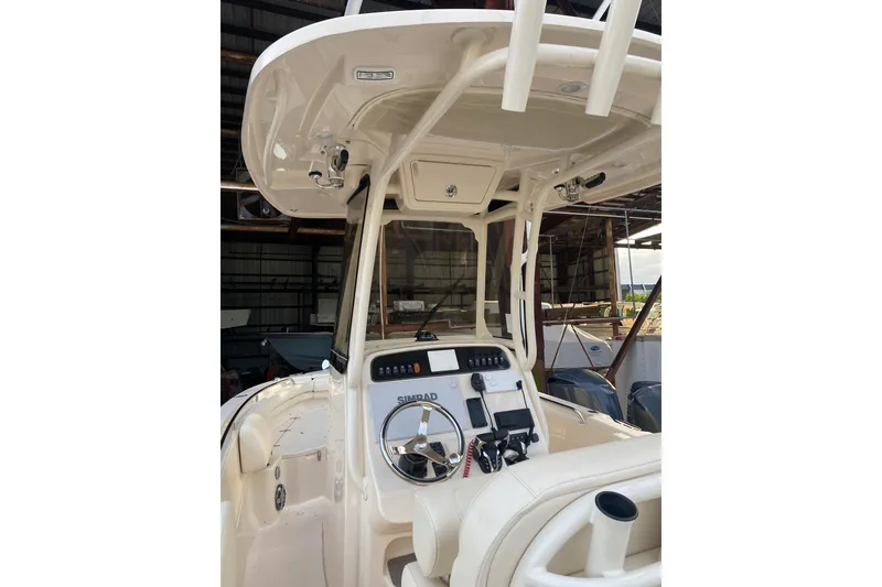 Slide: The Image of 2024 Grady-White Fisherman 257 boat interior with steering console and controls. - 5