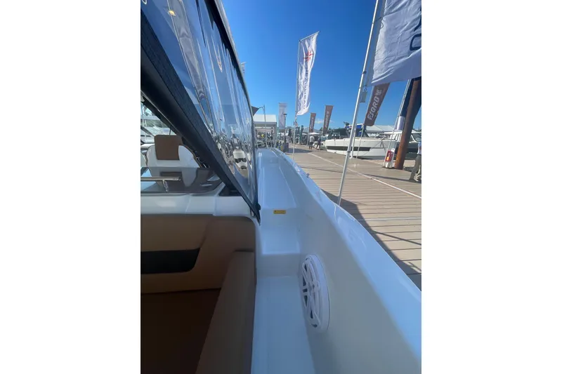 Slide: The Image of 2026 Jeanneau TH38 boat at marina, showcasing sleek design and modern features. - 13