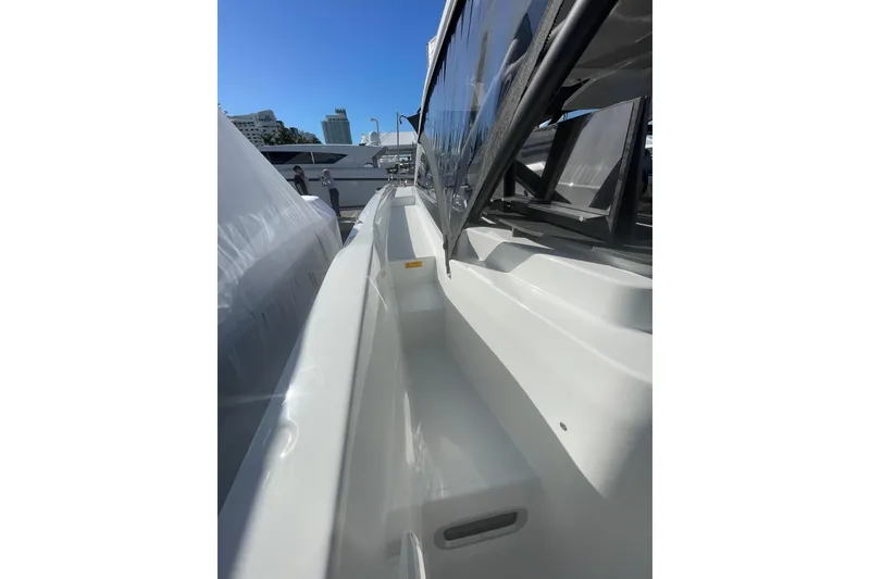 Slide: The Image of 2026 Jeanneau TH38 yacht side view, showcasing sleek design and modern features. - 14