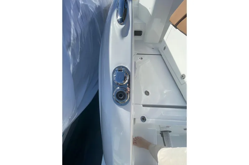 Slide: The Image of 2026 Jeanneau TH38 boat deck with chrome fittings and white surface. - 15
