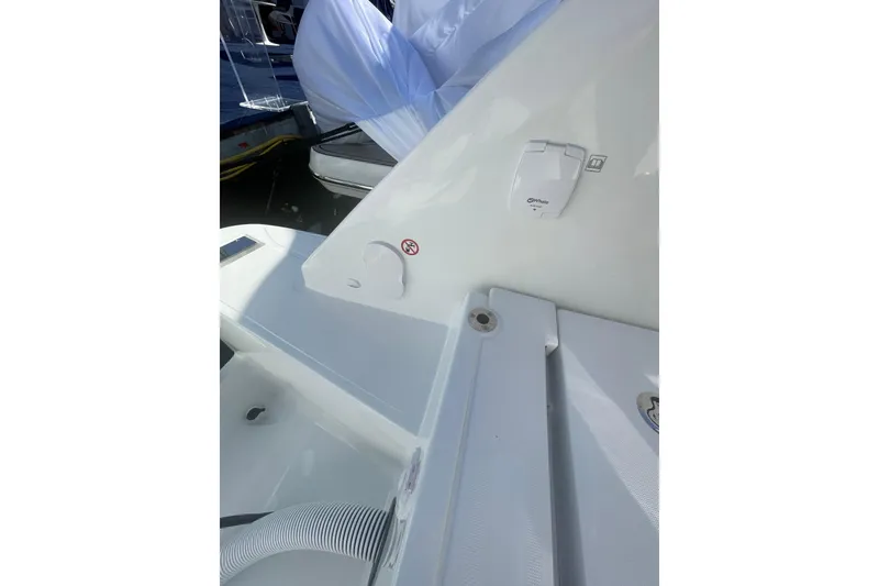 Slide: The Image of 2026 Jeanneau TH38 boat deck with white fittings and hose. - 16