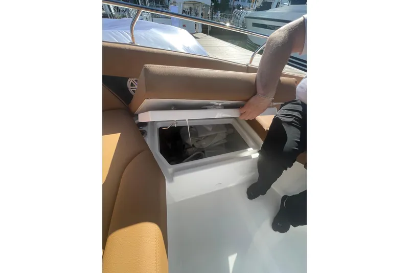 Slide: The Image of 2026 Jeanneau TH38 boat with open storage compartment on deck. - 20