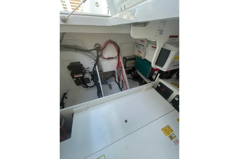 Slide: The Image of Engine compartment of 2026 Jeanneau TH38 boat, showcasing wiring and equipment. - 22