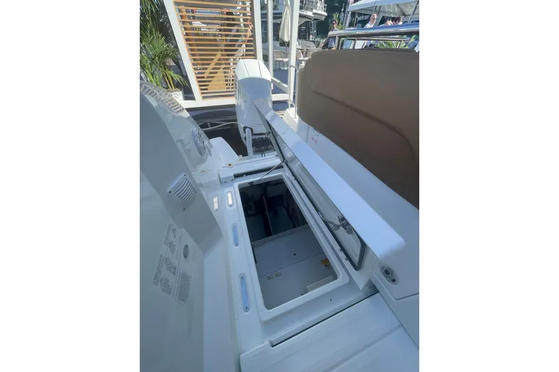 Slide: The Image of 2026 Jeanneau TH38 boat interior storage compartment with open hatch. - 23