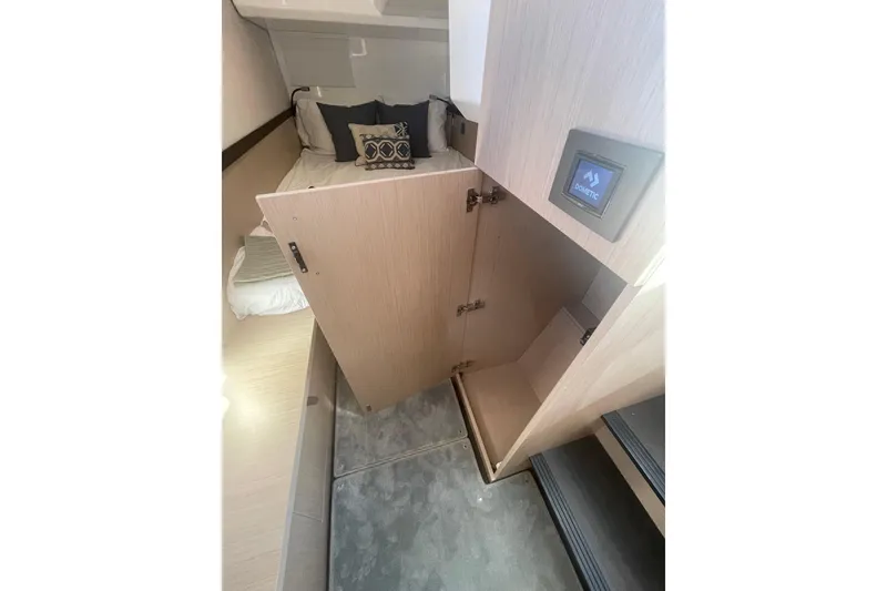 Slide: The Image of 2026 Jeanneau TH38 interior cabin with open storage, bed, and modern design elements. - 25