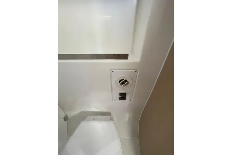 Slide: The Image of Interior detail of 2026 Jeanneau TH38 boat, featuring a vent and control panel. - 30