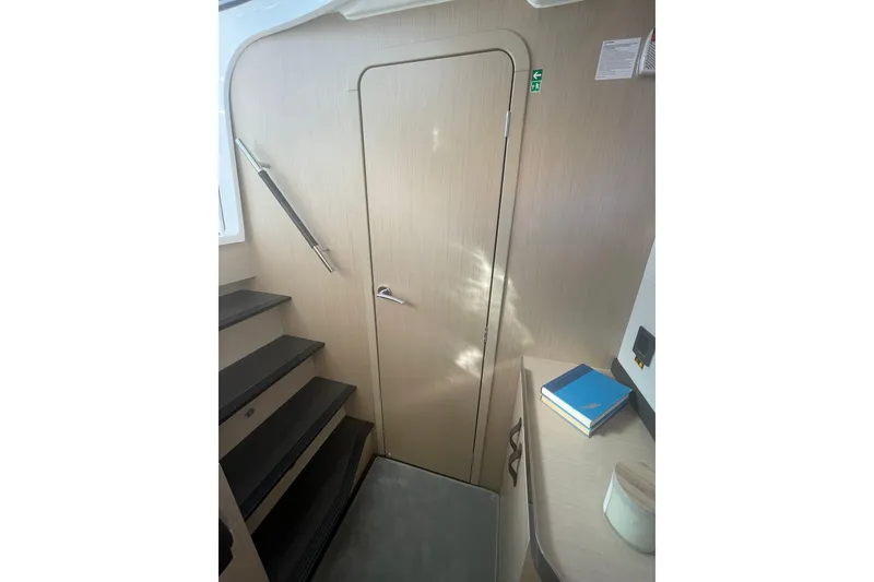 Slide: The Image of Interior of 2026 Jeanneau TH38 yacht with stairs and wooden door. - 37