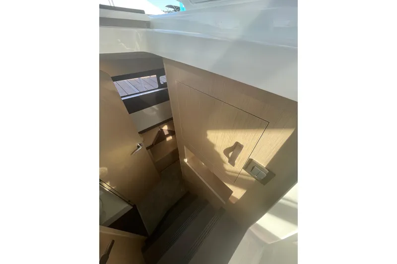 Slide: The Image of Interior of 2026 Jeanneau TH38 yacht, featuring modern wood paneling and sleek design. - 41