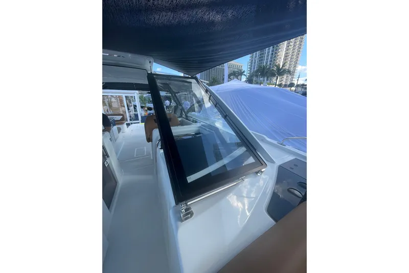 Slide: The Image of 2026 Jeanneau TH38 yacht interior with modern design and sleek windows. - 45