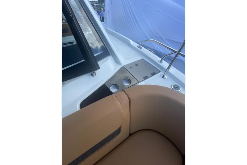 Slide: The Image of Interior view of 2026 Jeanneau TH38 boat with tan seating and sleek design. - 51